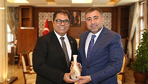 Okur’dan Aslan’a ziyaret