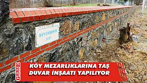 Kırsaldaki mezarlıkların duvarları inşa ediliyor