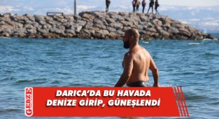 Buz gibi suya girip kumsalda güneşlendi