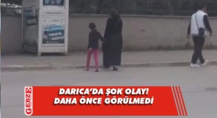 Çocuğunu giysi kumbarasına soktu