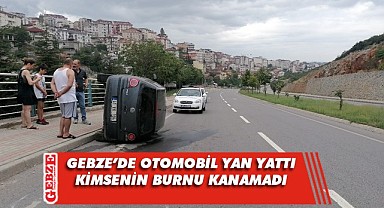 Yan yatan otomobilden burunları bile kanamadan çıktılar