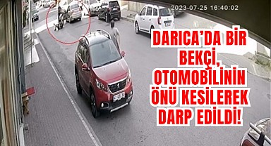 Otomobilin önünü kesip bekçiyi darp ettiler